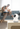ieGeek Smart home security camera on a table with a family in the background